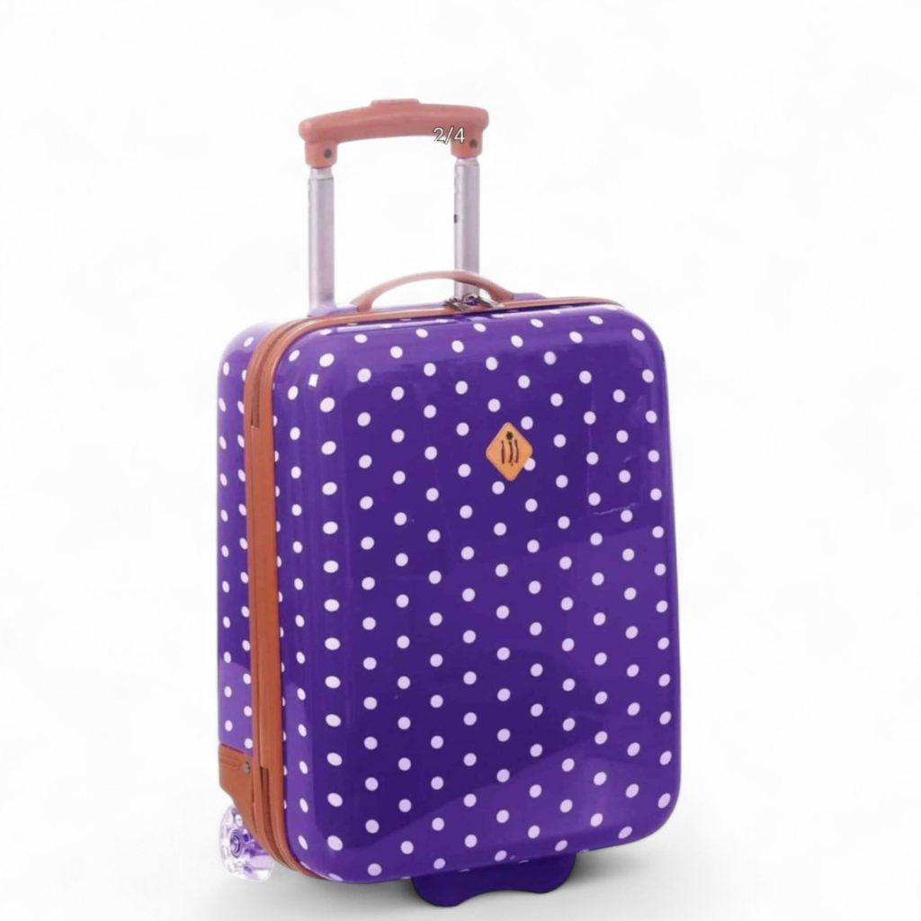 Valise à roulettes violette à pois blancs pour enfants.