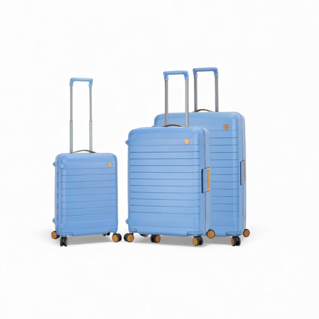 Bagages en polycarbonate bleu avec roulettes, poignée télescopique et compartiments spacieux.
